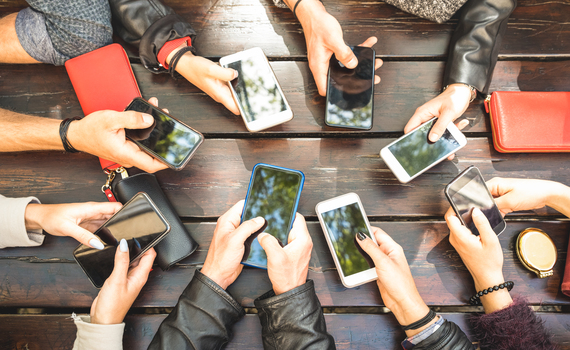 people-group-having-addicted-fun-together-using-smartphones-detail-of-hands-sharing-content-on-social-network-with-mobile-smart-phones-technology-concept-with-millennials-online-with-cellphones