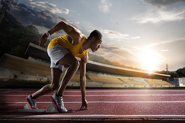 sport-sprinter-leaving-starting-blocks-on-the-running-track-