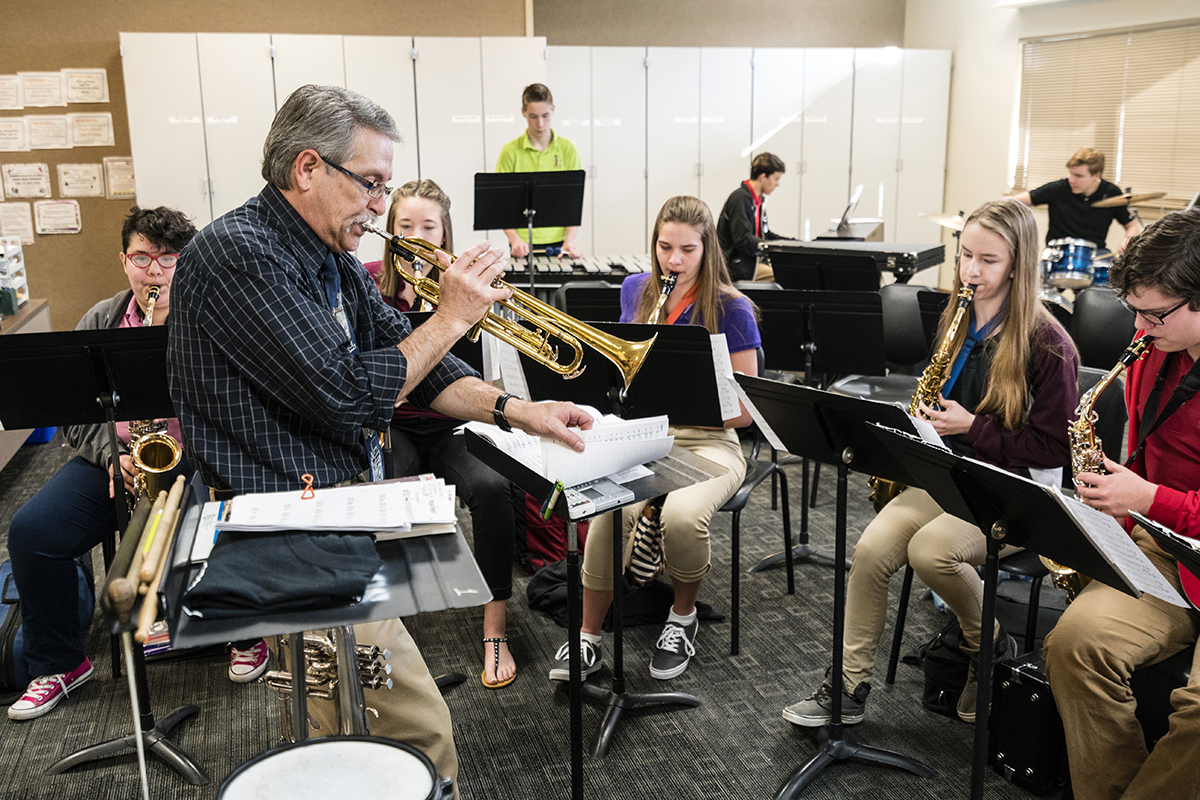 teacher-playing-trumpet-in-music-class