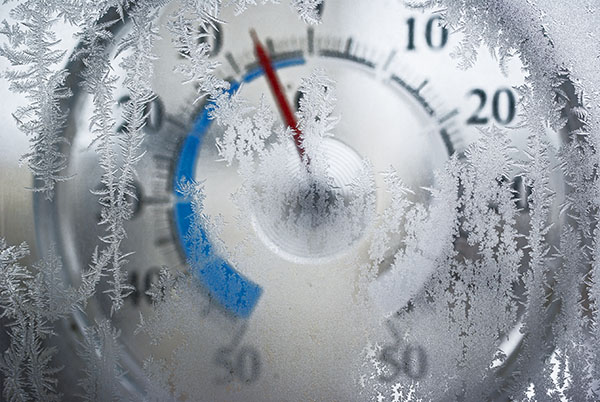 thermometer-behind-the-frozen-window