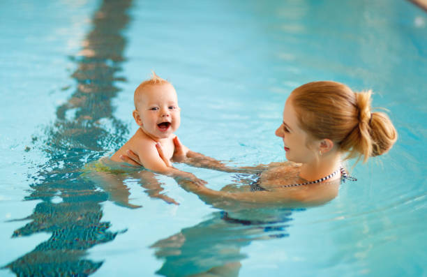 mother-and-baby-swim-in-the-pool