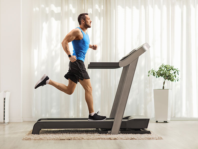 young-man-running-on-a-treadmill-at-home