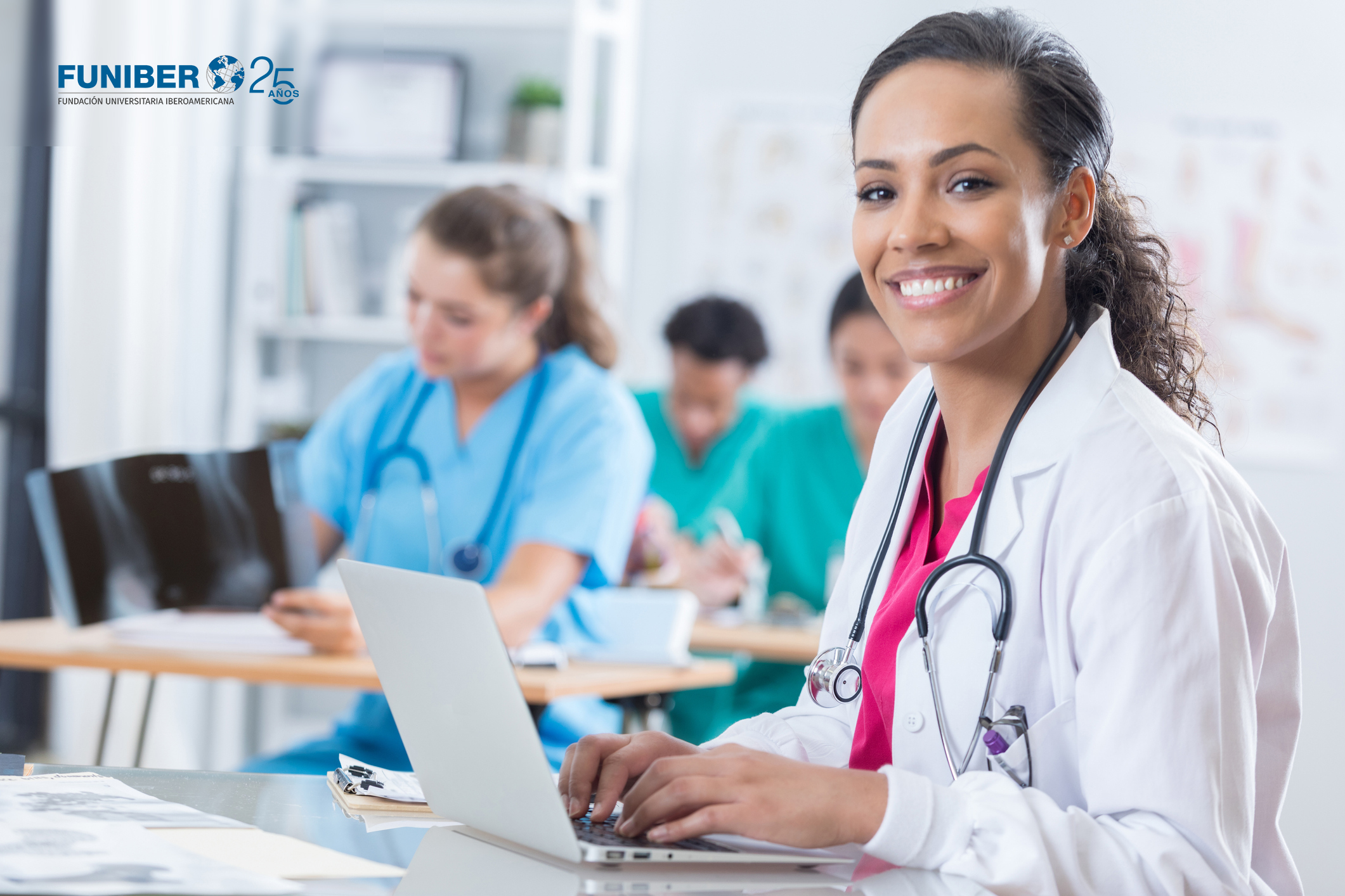 cheerful-medical-intern-uses-a-laptop-in-the-classroom