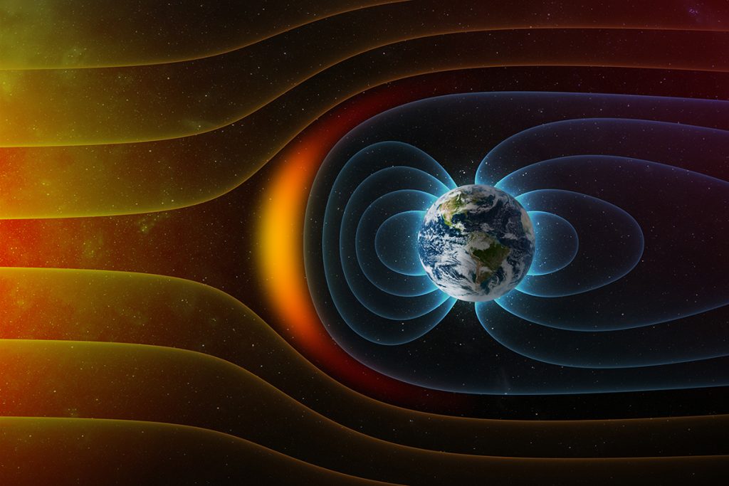 El campo magnético de la Tierra contra el viento solar del Sol. 